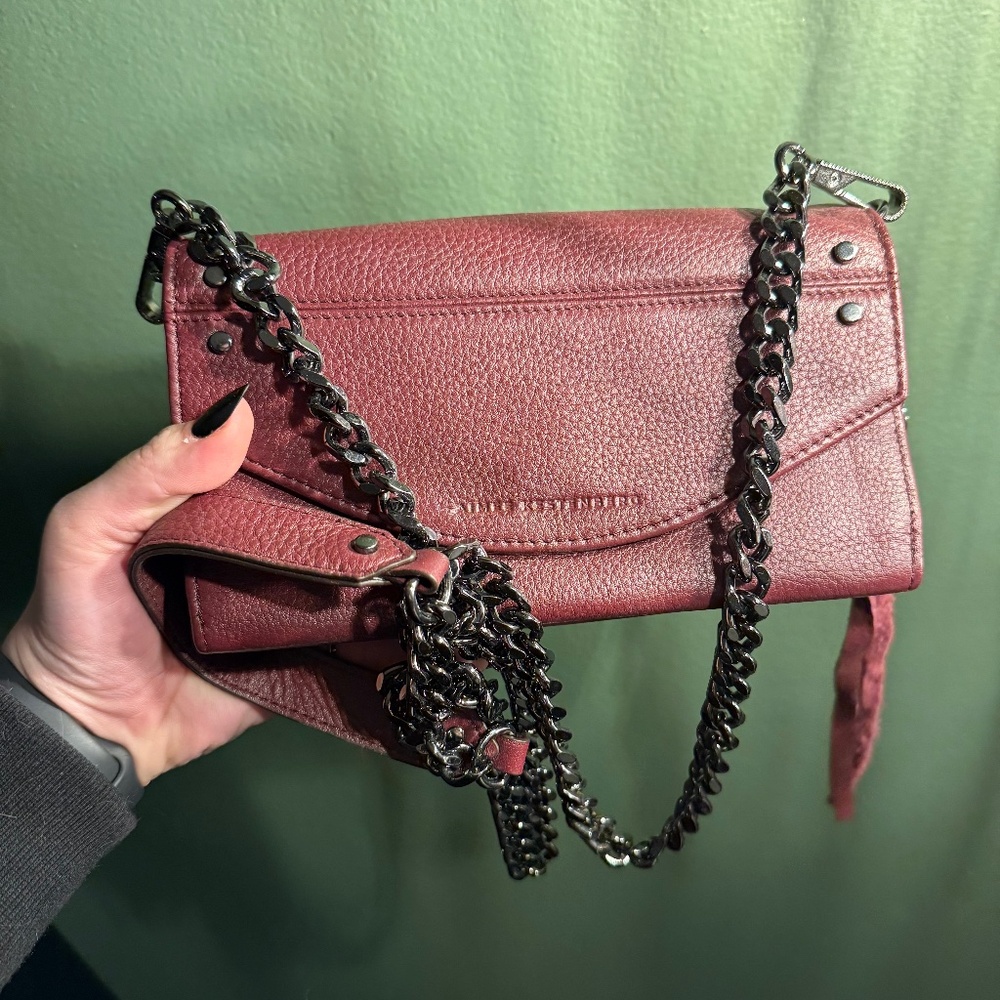 Burgundy crossbody purse with black chain